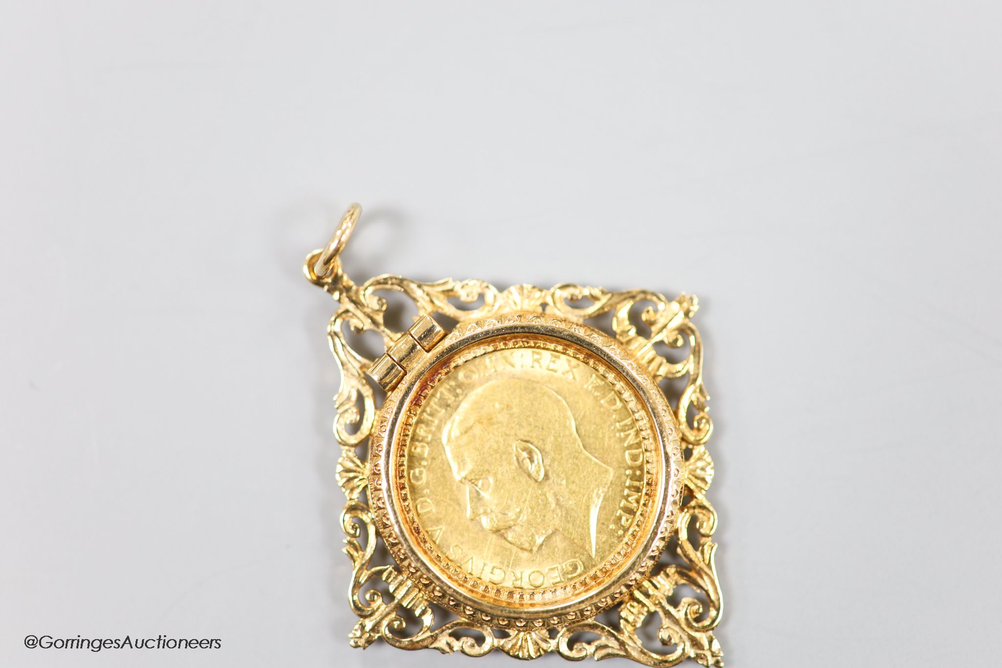 A George V 1912 gold sovereign, in a modern 9ct gold pendant mount, gross 10.4 grams.